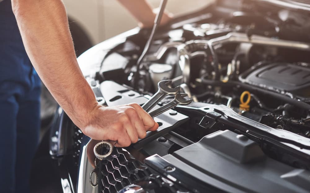 Mechanic working on a car engine