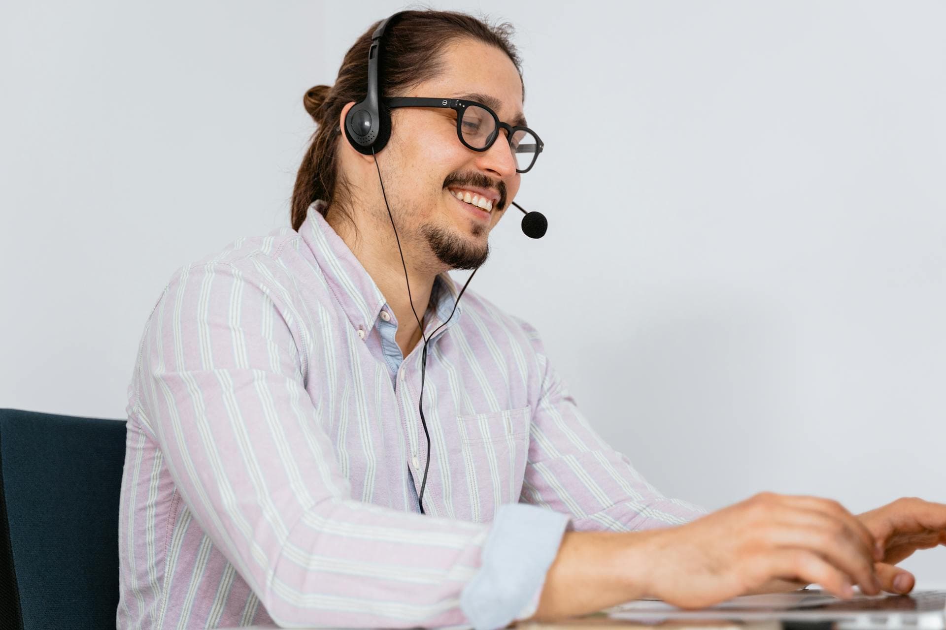 Customer support representative wearing a headset